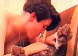 Dog relaxing and getting a BJ